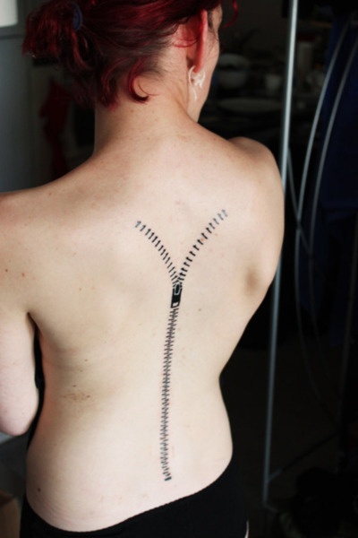 Girl’s back zip tattoo