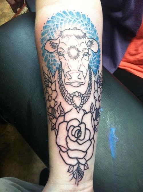 Gorgeous black cow tattoo