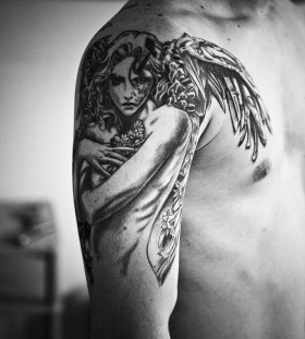 Gorgeous girl's angel tatoo on arm