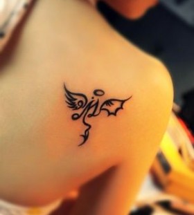 Gorgeous girl's angel tattoo on shoulder