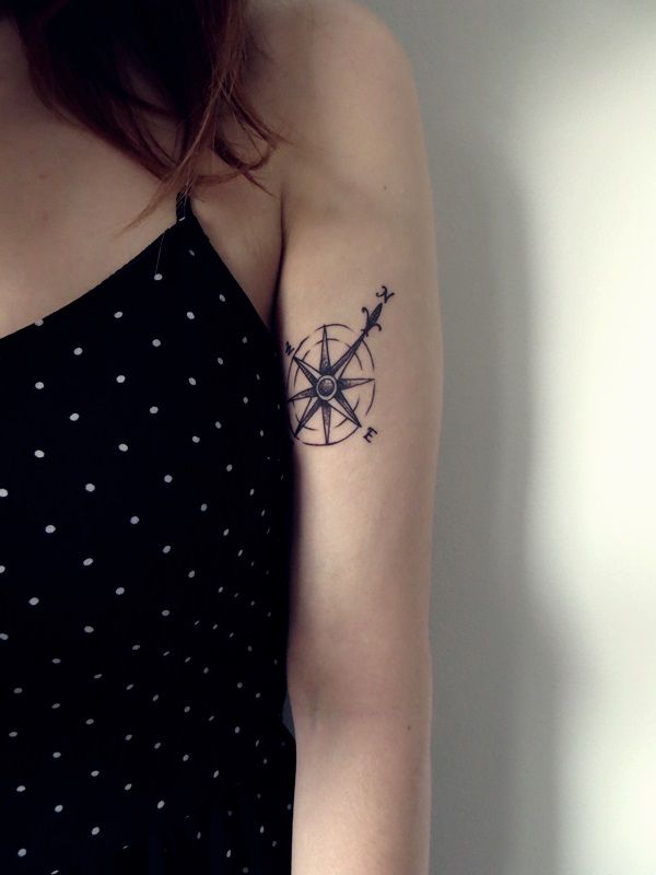 Gorgeous girl’s compass tattoo on arm