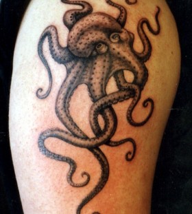 Great black octopus tattoo on leg