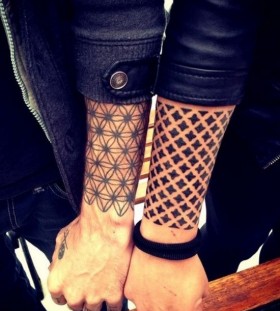 Great looking black two geometric arm tattoos