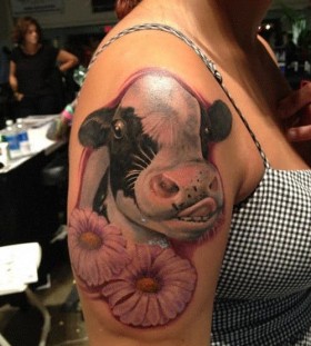 Great looking cow tattoo