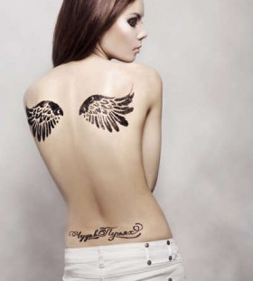 Great looking girl's angel tattoo on shoulder
