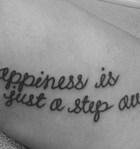 Happiness quote girl tattoo on foot