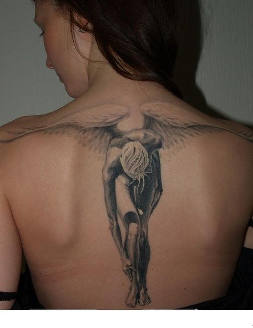 Huge men’s angel tattoo on shoulder