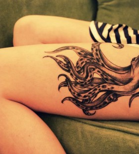 Huge women's octopus tattoo on leg