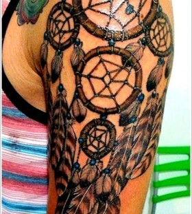 Leopard style dreamcatcher tattoo