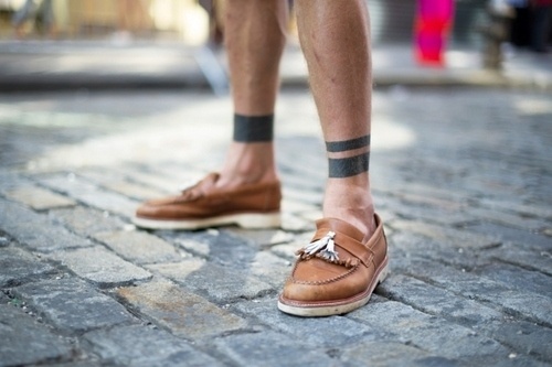 Lovely shoes and black men’s geometric tattoo on leg