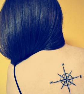 Lovely women's compass tattoo on back