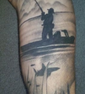 Men's black fishing tattoo