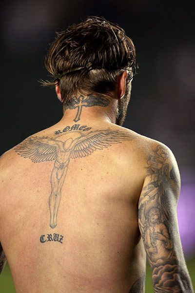 Men’s full body angel tattoo on shoulder