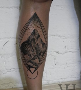 Mountains and leg geometric tattoo on leg