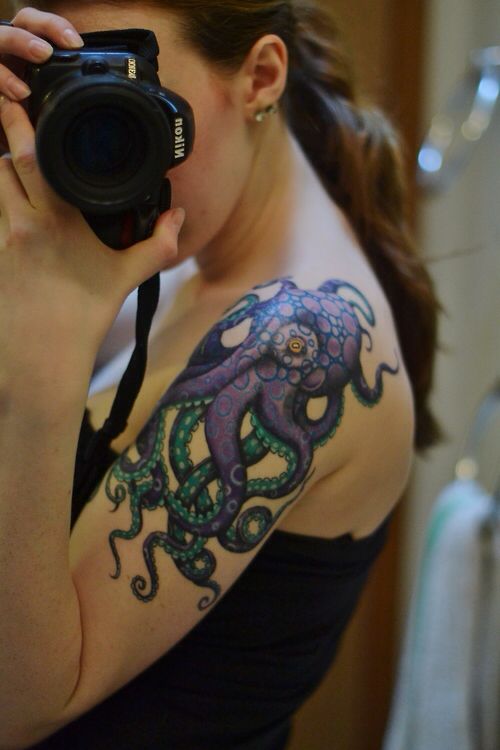 Nikon camera octopus tattoo on arm