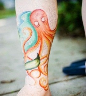 Orange, blue octopus tattoo on leg