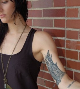 Pretty girl's black geometric arm tattoo