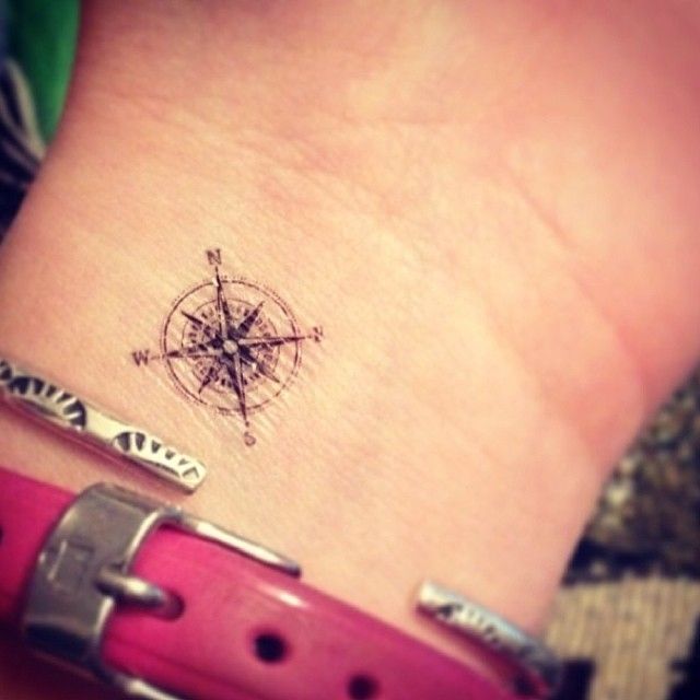 Pretty small wrist compass tattoo on arm
