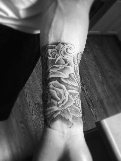 Pretty women’s angel tattoo on arm