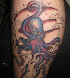 Purple and black octopus tattoo on leg