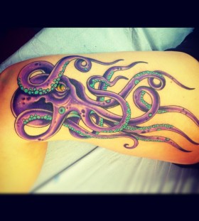 Purple eyes and octopus tattoo on leg