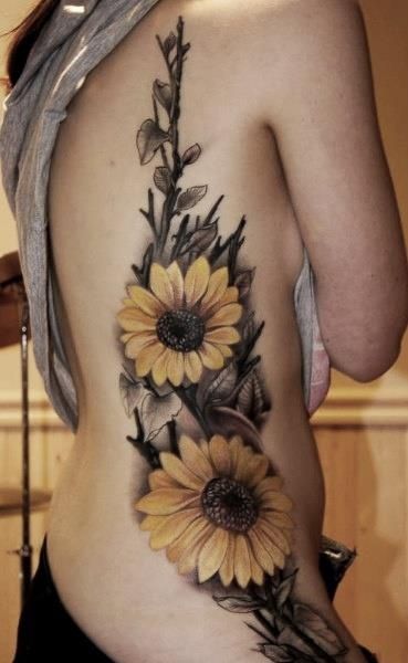 Realistic girl’s sunflowers yellow tattoo