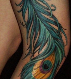 Realistic look peacock tattoo on leg