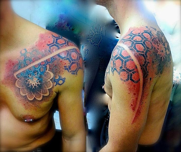 Red and black astro style geometric shoulder, back tattoo