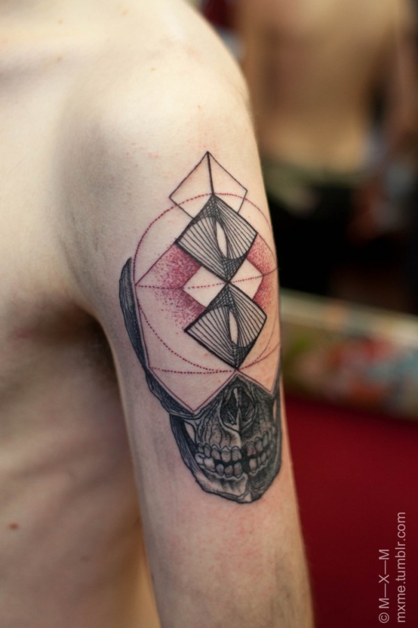 Red and black geometric arm tattoo