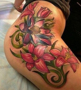 Red flowers girl tattoo on hip