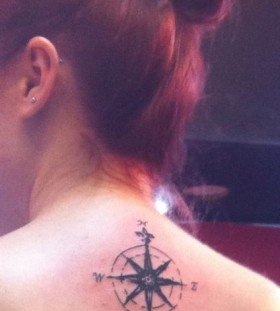 Red hair girl compass tattoo on back