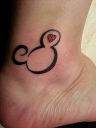 Red heart Mickey Mouse tattoo on leg
