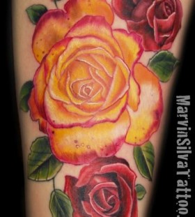 Red rose and yellow tattoo