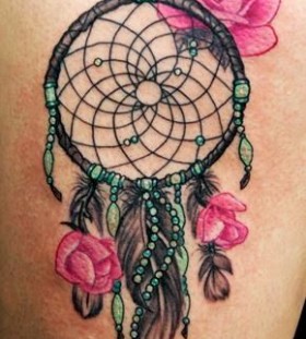 Red roses and dreamcatcher tattoo
