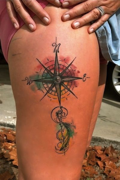 Sharp ornaments compass tattoo on leg