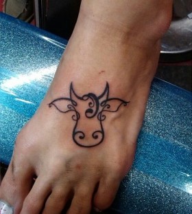 Simple foot cow tattoo
