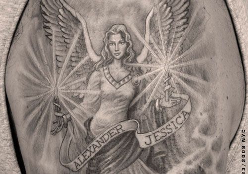 Simple women’s angel tatoo on arm