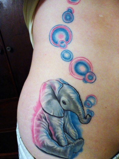 Small elephant with bubbles tattoo