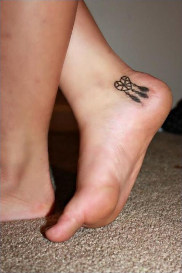 Small heart girl tattoo on foot