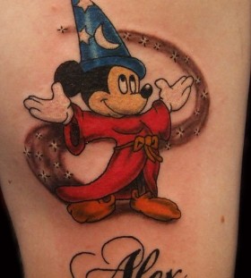 Stars, moons Mickey Mouse tattoo on arm