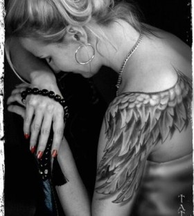 Women's full hand angel tattoo on shoulder