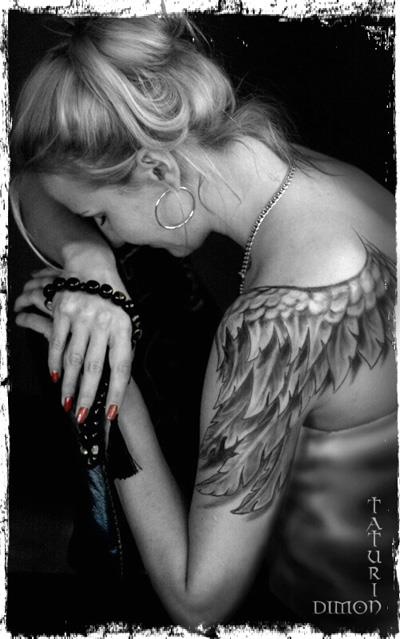 Women’s full hand angel tattoo on shoulder