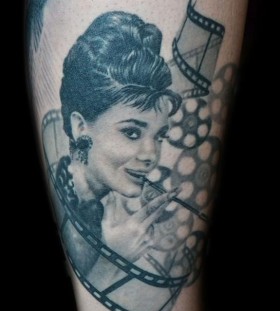 audrey with movie reels tattoo