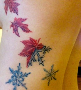 autumn leaves with snowflakes tattoo