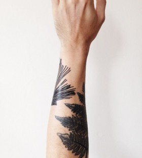 black leaves tattoo on hand