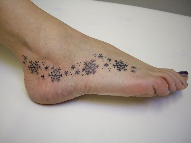 black snowflake tattoo on foot