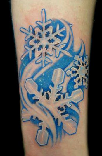 blue snowflake tattoo on arm