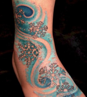 blue snowflake tattoo on leg