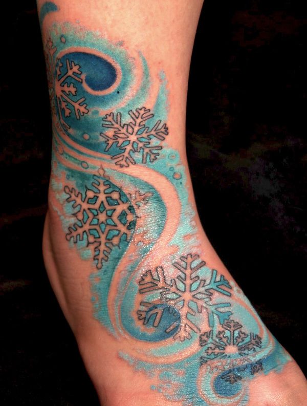 blue snowflake tattoo on leg