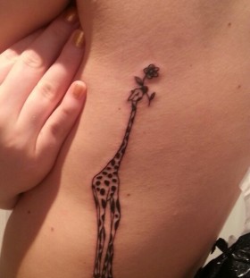 giraffe with flower tattoo